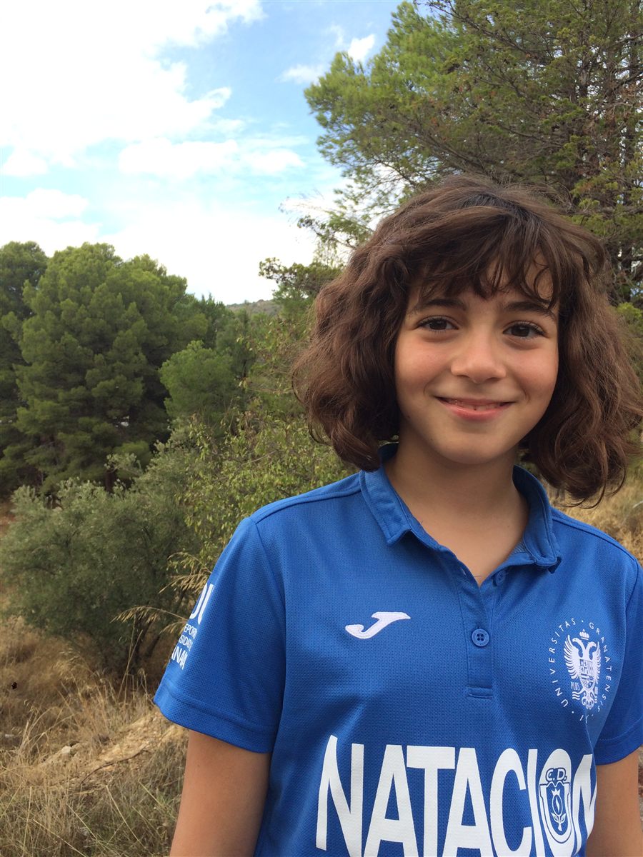 Zoë aged 10 in a University of Granada swimming polo shirt