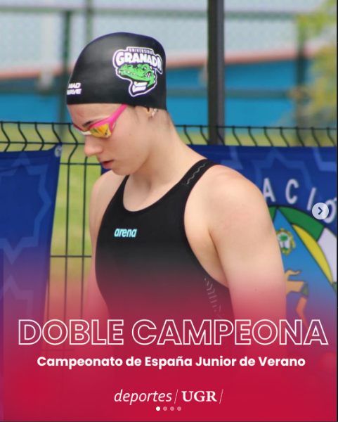 Zoë in a University of Granada cap before a race, on a poster reading Double champion, Spanish Junior Summer Championships